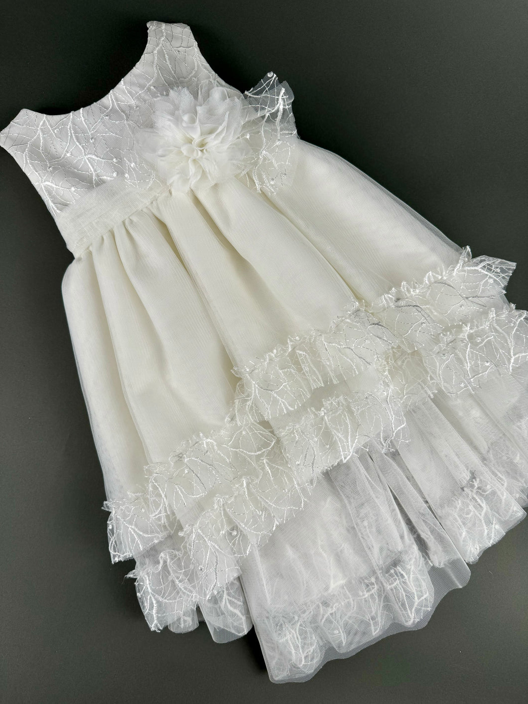 Dress 104 Girls Baptismal Christening Sleeveless Layered Dress with French lace, accented with Flower, matching Bolero and Hat. Made in Greece exclusively for Rosies Collections. 2025104