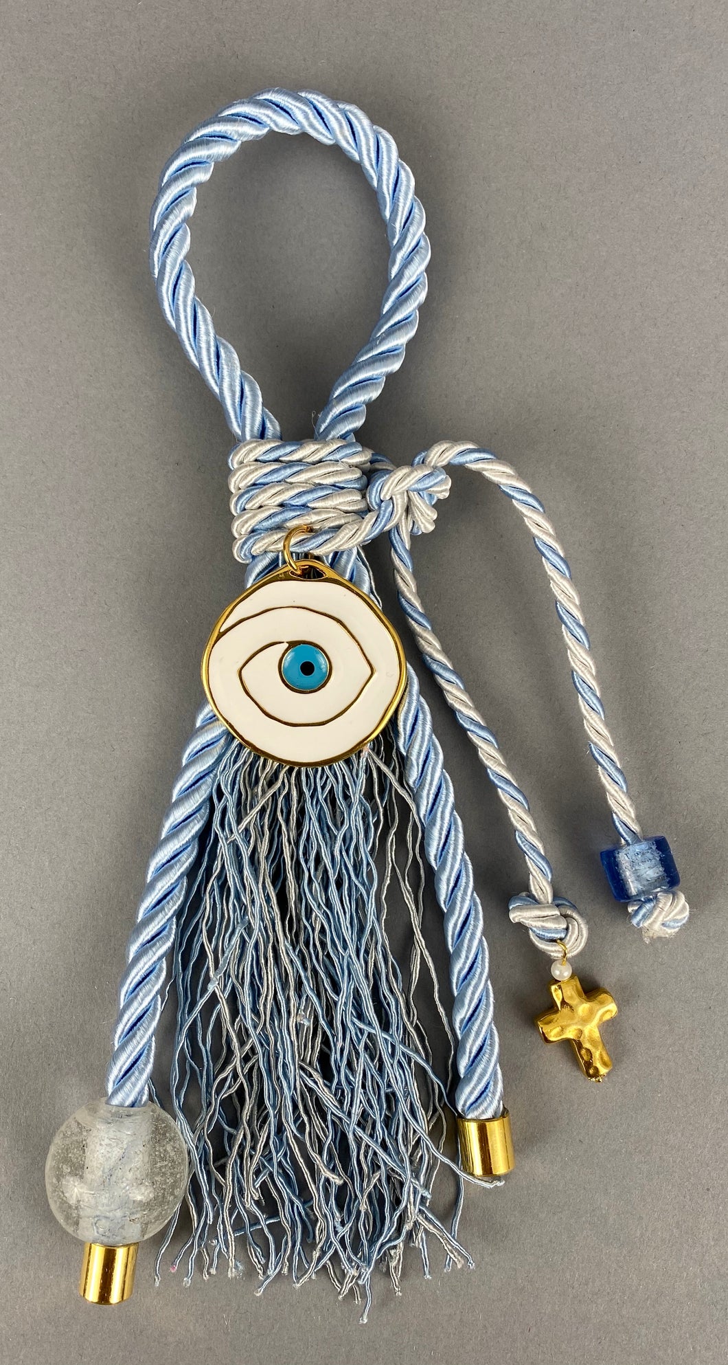 Gouri 1018 Pearl Light Blue Cord Gouri, round Metal Mati, large Murano Glass Bead with metal Cross.  Measures 10” in length.