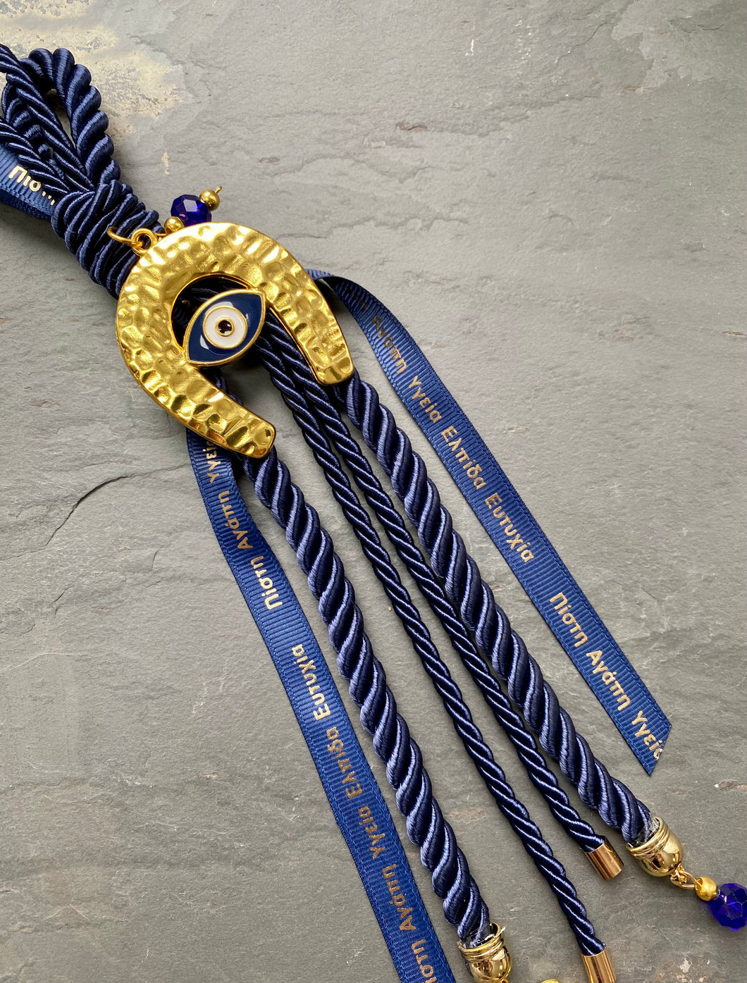 Good Luck Gouri with Metal Lucky Horse Shoe  on Navy Blue Rope with Greek Ribbons and Charms GG202320